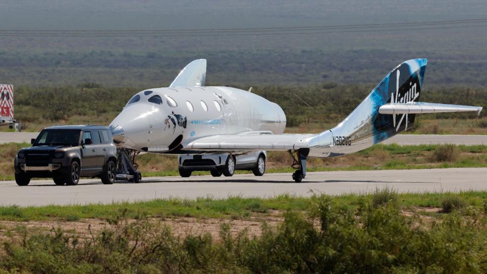 VSS Unity is towed after reaching the edge of space