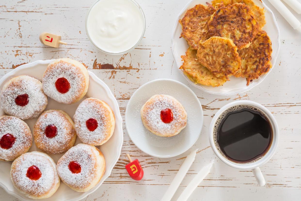 Symbols of the Hanukkah celebration include donuts and latkes.