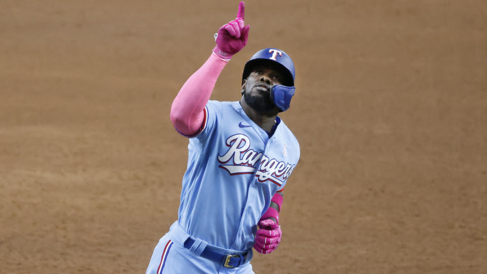 Texas Rangers center fielder Adolis Garcia (53) celebrates his three-home run against the Seattle Mariners, during the fifth inning of a baseball game Sunday, May 9, 2021, in Arlington, Texas. (AP Photo/Michael Ainsworth)