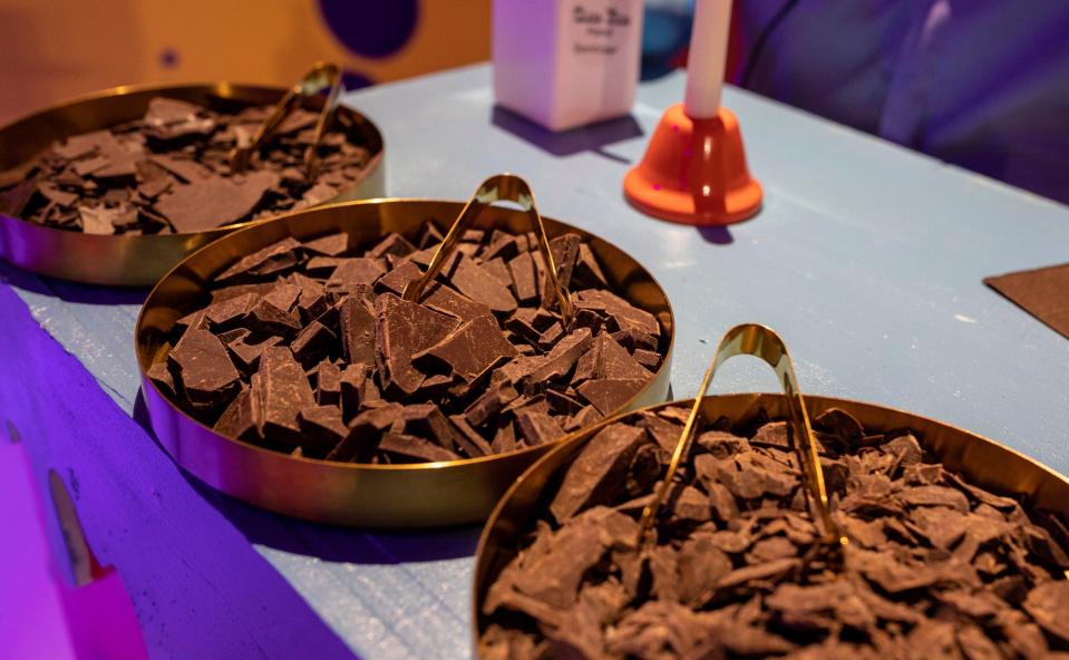 Three trays full of different percentages of dark chocolate sit on an exhibit inside the Choco Town Detroit at the Oakland Mall in Troy on Wednesday, March 15, 2023. 