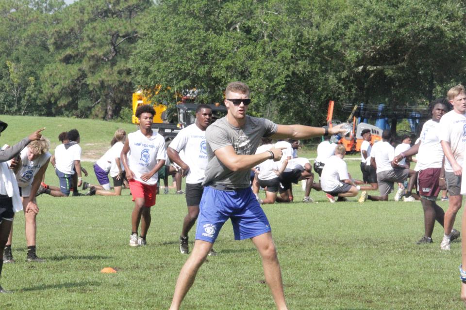 A UWF football player leads one of the footwork drills during the UWF football camp on Saturday, July 15, 2023.