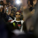 <p>Lezley McSpadden, mother of Michael Brown looks at law enforcement officers as she attends a protest at the Ferguson Police Department Saturday, Oct. 11, 2014, in Ferguson, Mo. (AP Photo/Charles Rex Arbogast) </p>