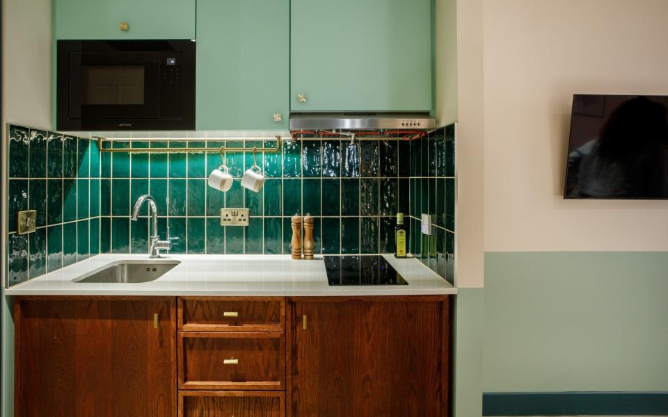 Hometel rooms are more about utilitarian pot- and pant-washing than roaring open fires