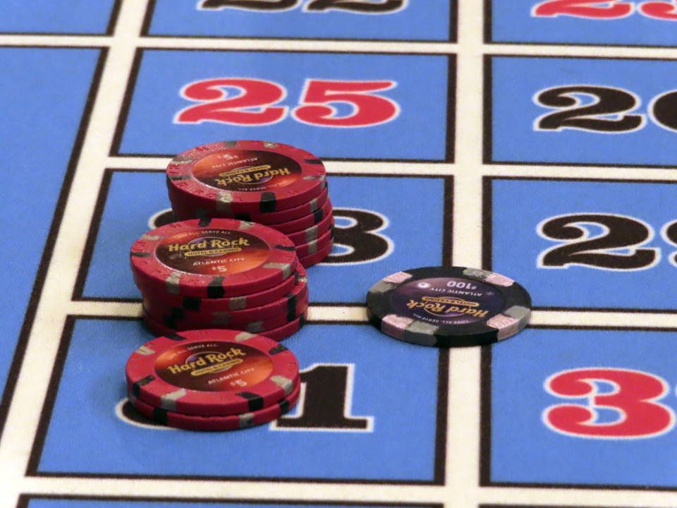 Gambling chips sit on a table during a game of roulette at the Hard Rock casino in Atlantic City, N.J., on May 17, 2023. Figures released on Aug. 22, 2023, by the New Jersey Division of Gaming Enforcement show Atlantic City's nine casinos posted a gross operating profit of nearly $146 million in the second quarter of this year. That is down 20.5% from the same period a year ago, and also less than the $159 million operating profit they posted in the second quarter of 2019. (AP Photo/Wayne Parry)