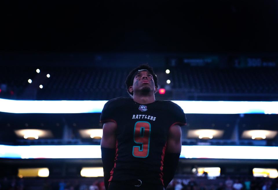 Rattlers' Kyree Woods (9), shown listening to the national anthem during the home opener against Duke City at the Footprint Center, helped spark Arizona's 58-38 win over the Gladiators in New Mexico with an interception return for a touchdown on June 18.