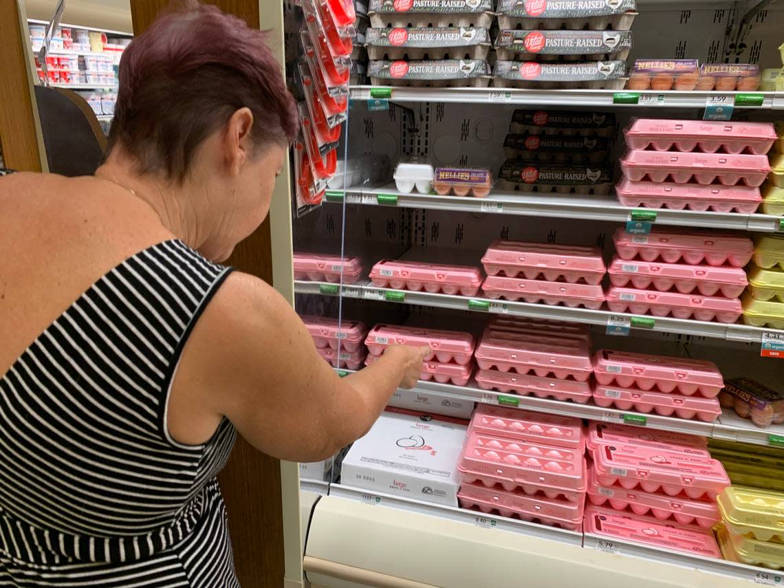 Mayra Odio, a customer at Publix at the Palms at Town & Country Mall points to the price of eggs and is stunned at the prices. ‘I can’t believe this. Is this how much it costs? It’s unbelievable. I mean, it’s incredible,’ she said on Thursday, Jan. 12, 2023.