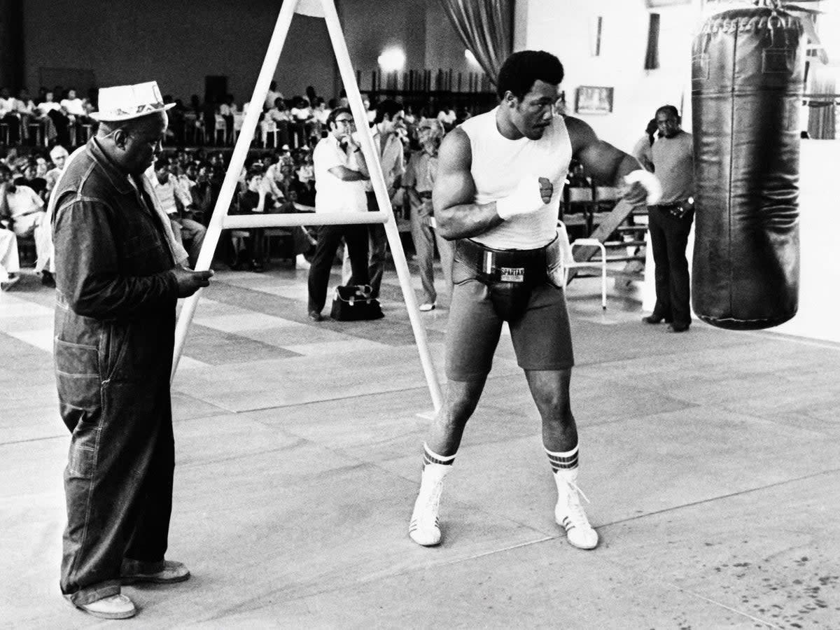 George Foreman in training ahead of his life-defining fight against Muhammad Ali in 1974 (Getty)