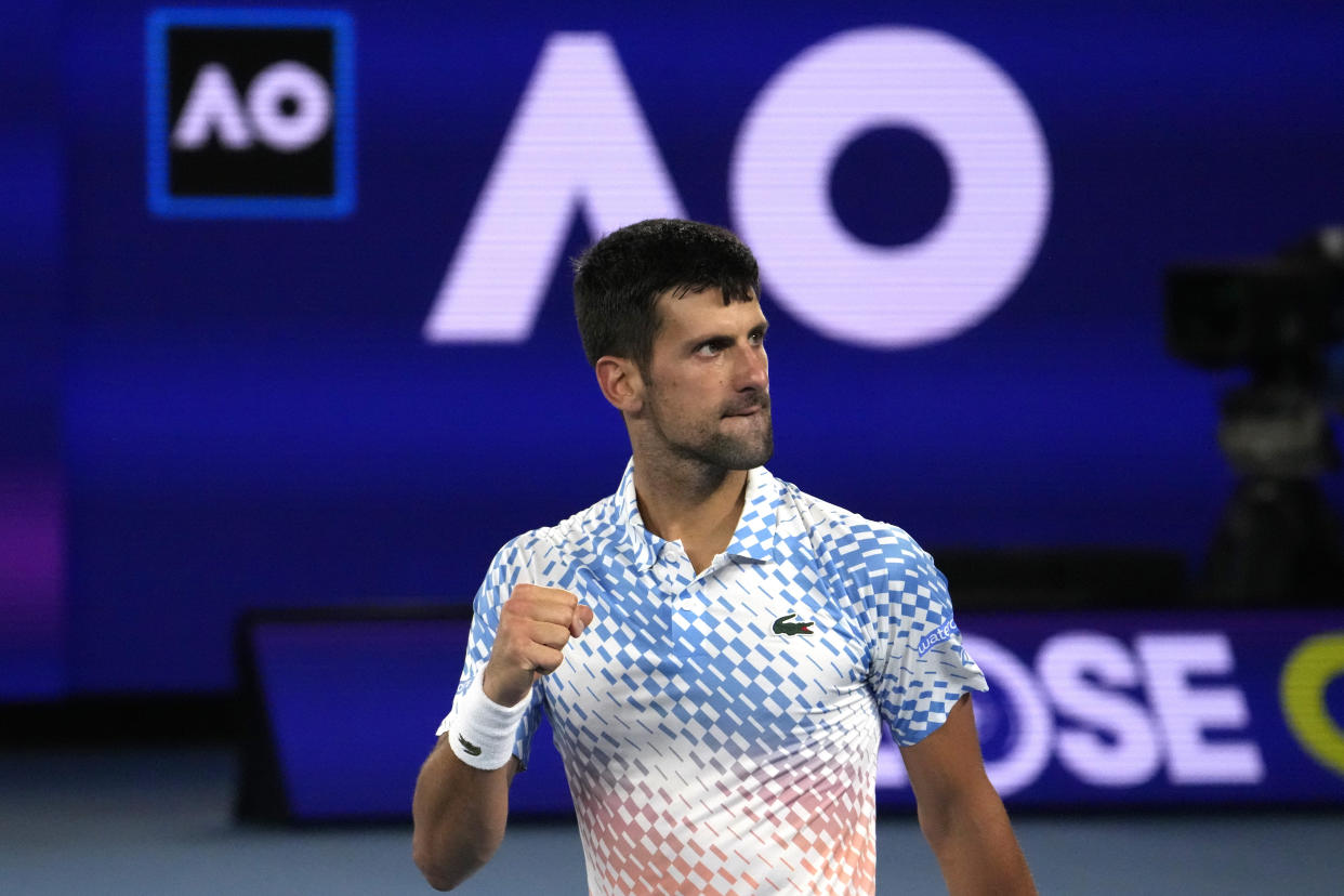 Novak Djokovic of Serbia reacts after winning a point against Andrey Rublev of Russia during their quarterfinal match at the Australian Open tennis championship in Melbourne, Australia, Wednesday, Jan. 25, 2023. (AP Photo/Ng Han Guan)