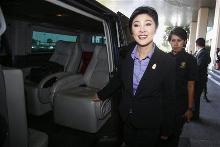 Thailand's Prime Minister Yingluck Shinawatra leaves the Government Complex after a meeting with the Election Commission in Bangkok December 20, 2013. REUTERS/Athit Perawongmetha