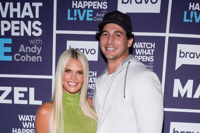 Madison Lecroy and her husband Brett Randle in front of a step and repeat at WWHL.