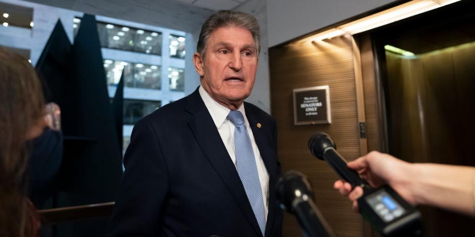 Sen. Joe Manchin, D-W.Va., leaves his office after speaking with President Joe Biden about his long-stalled domestic agenda, at the Capitol in Washington, Dec. 13, 2021.