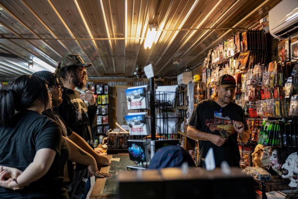 Customers peruse various decorations and memorabilia from horror movies at We Slaughter BBQ on Oct. 27, 2023 in Bastrop. The roadside rest stop and tourist attraction, now restored, is one of several Central Texas locations where the 1974 film Texas Chainsaw Massacre was filmed.    