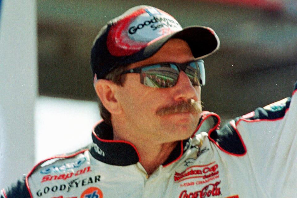 FILE - In this Feb. 18, 2001, file photo, Dale Earnhardt waves to fans during race introduction before the start of the Daytona 500 auto race at the Daytona International Speedway in Daytona Beach, Fla. Earnhardt, the greatest stock car star of his era, was killed in a crash on the last turn of the last lap of the race that day as he tried to protect Michael Waltrip's victory (AP Photo/Russell Williams, File)