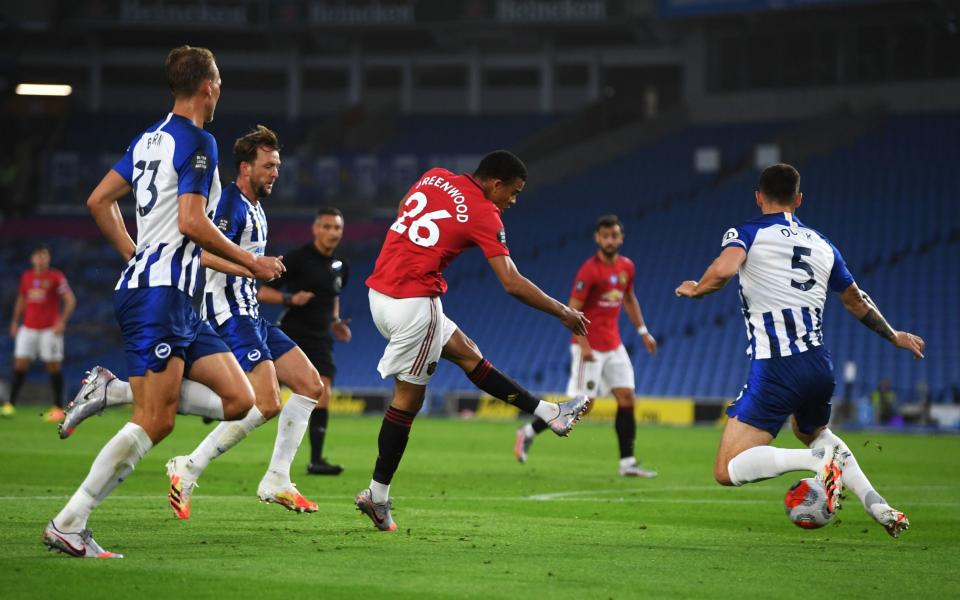Manchester United's Mason Greenwood scores his side's first goal of the game during the Premier League match  - PA