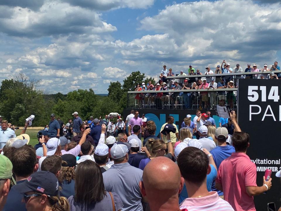 Former President Trump greets the crowd at the first tee of the LIV Golf event in Bedminster, New Jersey.