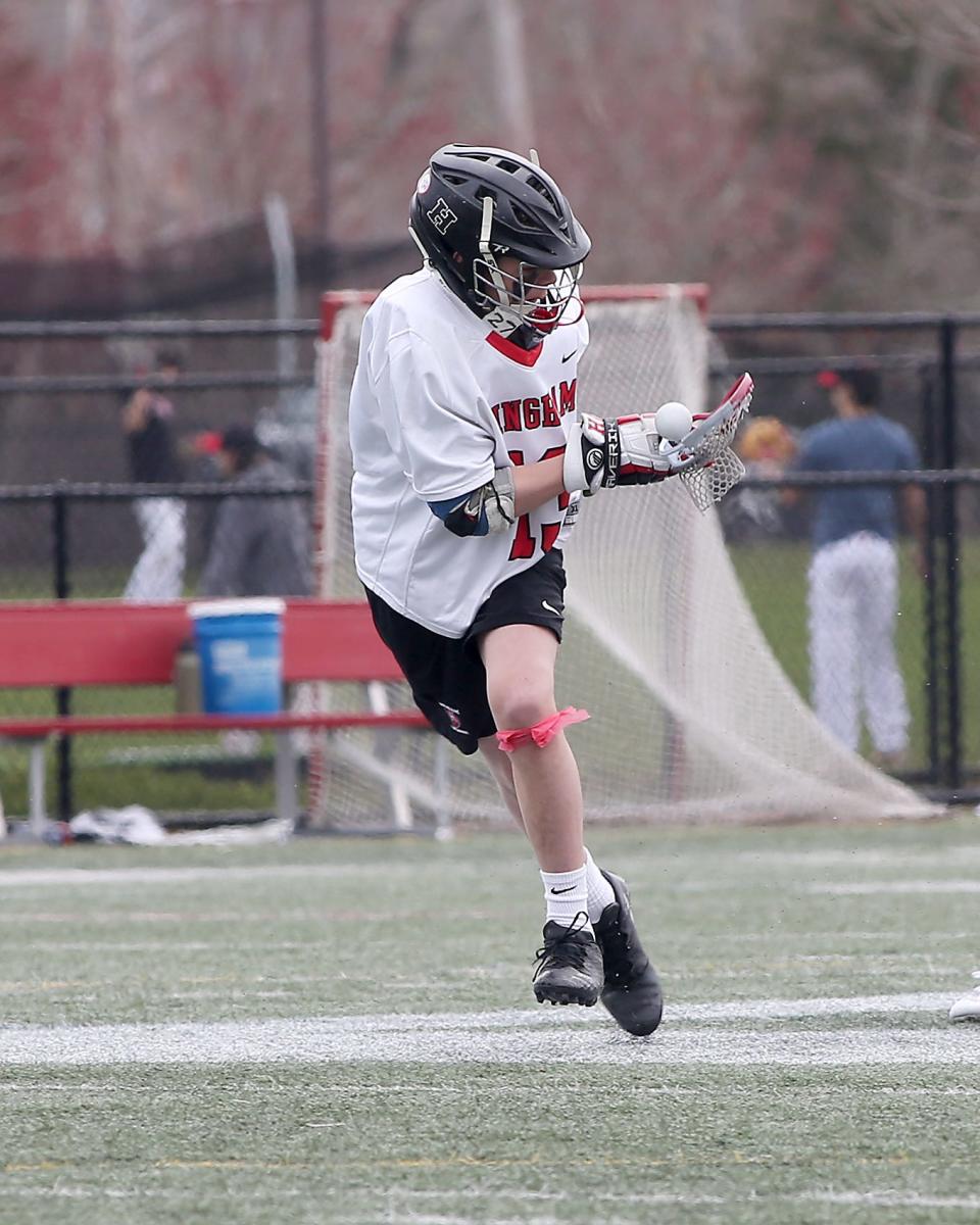 Hingham's Rocco Egan picks up the ground ball after winning the face off draw during second quarter action of their game against Needham at Hingham High School on Saturday, April 9, 2022.