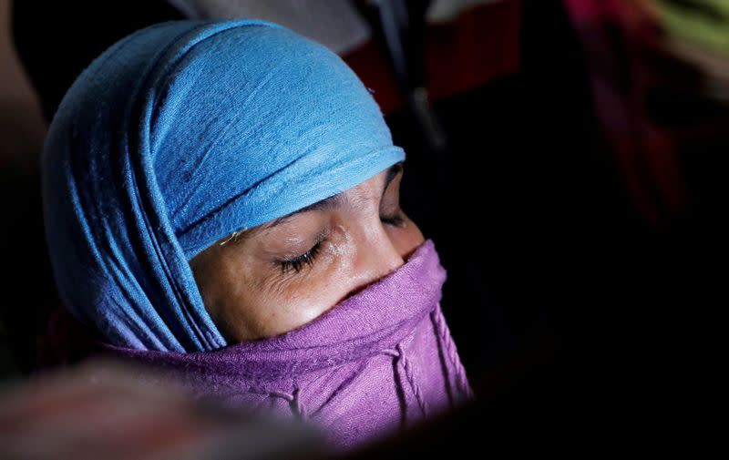 FILE PHOTO: Nasreen, mother of Asif, who died during clashes with police following protests against a new citizenship law, cries outside their house in Meerut