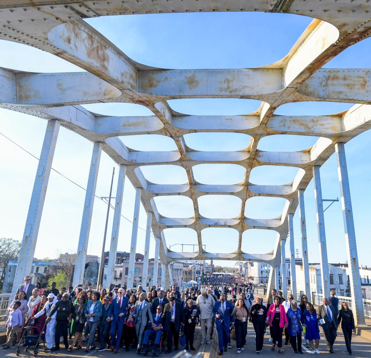 President Joe Biden, left center, marches across the Edmund Pettus Bridge in Selma, Alabama, on Sunday March 5, 2023, to commemorate the 58th anniversary of the "Bloody Sunday" bridge crossing.
