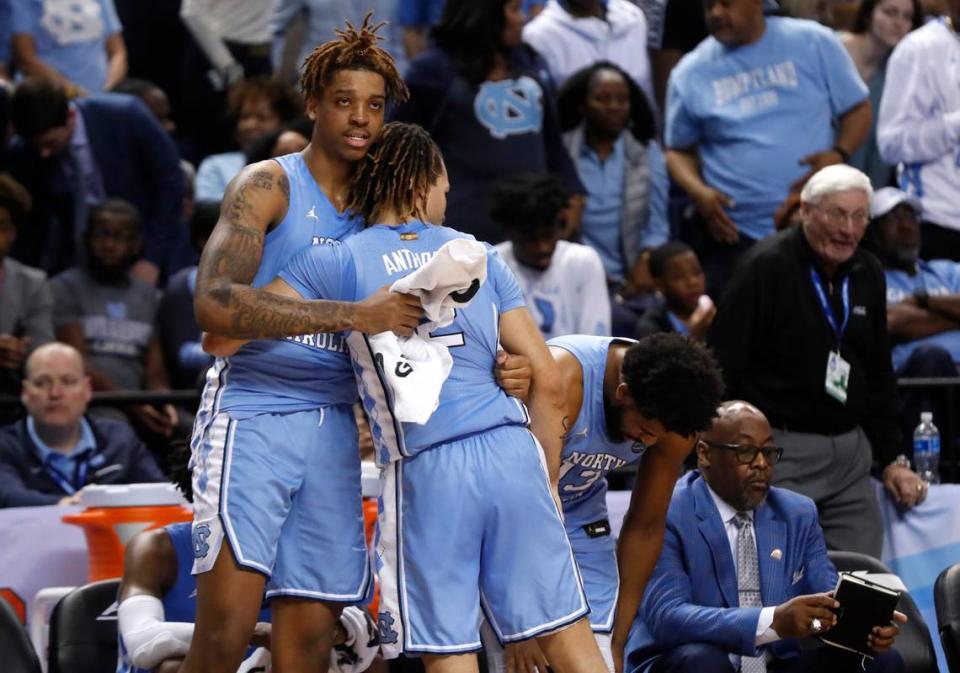 UNC’s Armando Bacot (5) hugs UNC’s Cole Anthony (2) as they come off the court in the final minutes of the Syracuse Orange’s 81-53 victory over the North Carolina Tar Heels in the second round of the ACC Tournament at the Greensboro Coliseum Wednesday, March 11, 2020.