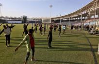 In this Monday, Feb. 17, 2020, photo, performers participate in rehearsal for opening ceremony of Pakistan Super League at National stadium in Karachi, Pakistan. Security concerns stopped foreign cricketers from touring Pakistan four years ago when the country's premier domestic Twenty20 tournament was launched, forcing organizers to stage the event on neutral turf in the United Arab Emirates. When the 2020 edition of the PSL starts in Karachi on Thursday, Darren Sammy of the West Indies and Shane Watson of Australia will be among 36 foreign cricketers involved in the six franchises. (AP Photo/Fareed Khan)