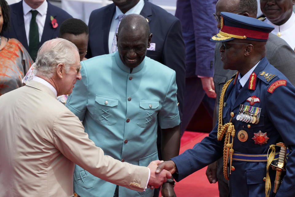 FILE - Kenya's military chief General Francis Ogolla, right, shakes hand with Britain's King Charles III, left, and Kenya's President William Ruto, center, as they attend a military welcome ceremony during Charles' visit at the Mtongwe Naval Base in Mombasa, Kenya, Nov. 2, 2023. Ogolla died in a helicopter crash west of the country, President William Ruto announced Thursday, April 18, 2024, evening and declared three days of national mourning. (AP Photo/Brian Inganga, File)