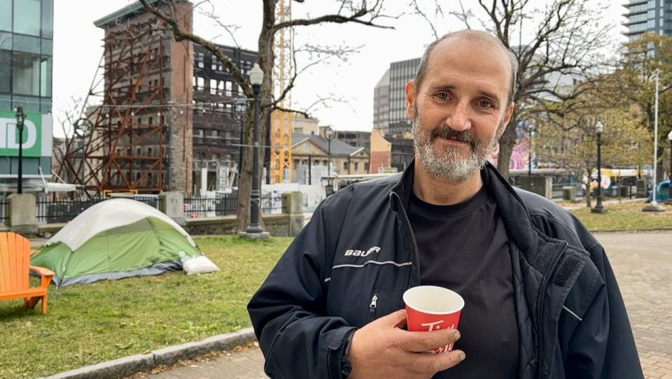 David Pincock is living in a tent at Grand Parade. He says generous strangers regularly bring food, clothes and other supplies.