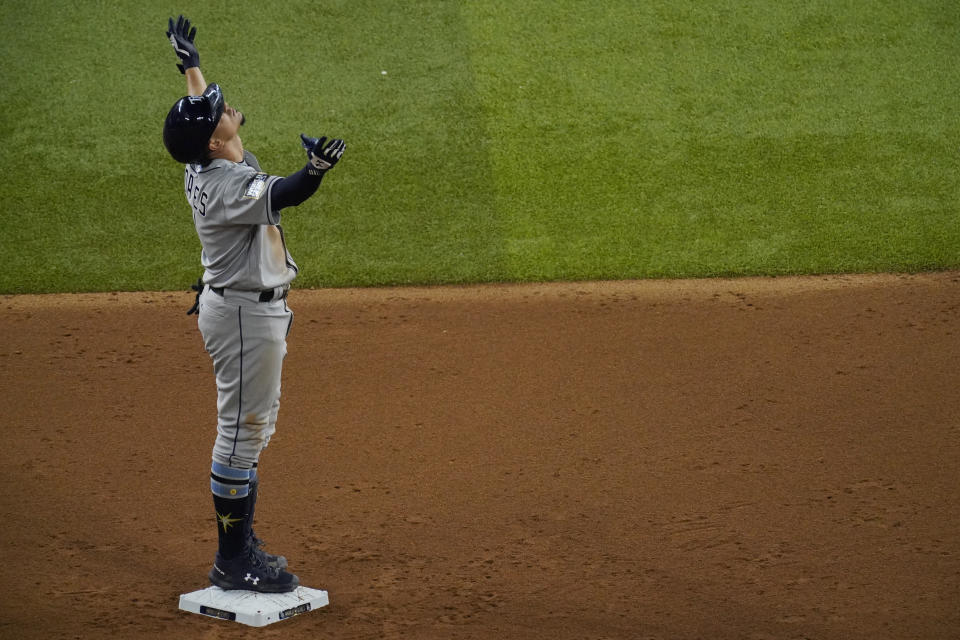 Tampa Bay Rays' Willy Adames celebrates after a double against the Los Angeles Dodgers during the seventh inning in Game 2 of the baseball World Series Wednesday, Oct. 21, 2020, in Arlington, Texas. (AP Photo/Sue Ogrocki)
