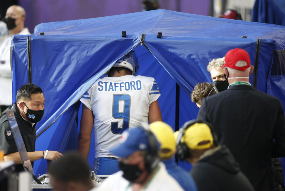 Detroit Lions quarterback Matthew Stafford (9) enters the injury after getting injured during the second half of an NFL football game against the Minnesota Vikings, Sunday, Nov. 8, 2020, in Minneapolis. (AP Photo/Bruce Kluckhohn)