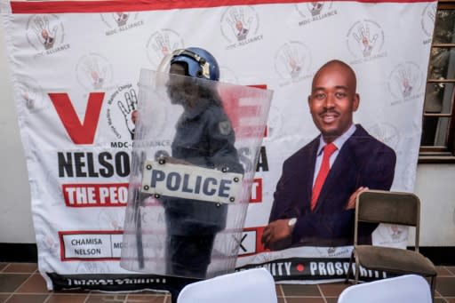 Anti-riot police arrive at a Harare hotel for Chamisa's press conference