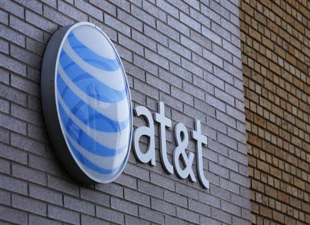 An AT&T sign is shown on a building in downtown San Diego, California March 18, 2014. REUTERS/Mike Blake