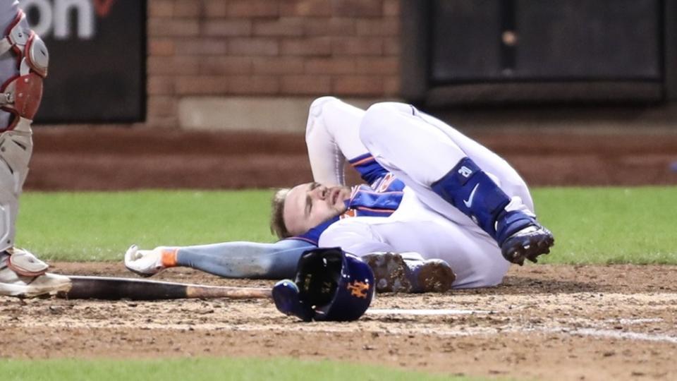 New York Mets first baseman Pete Alonso (20) lays on the ground after getting hit by a pitch in the eighth inning against the Los Angeles Angels at Citi Field.