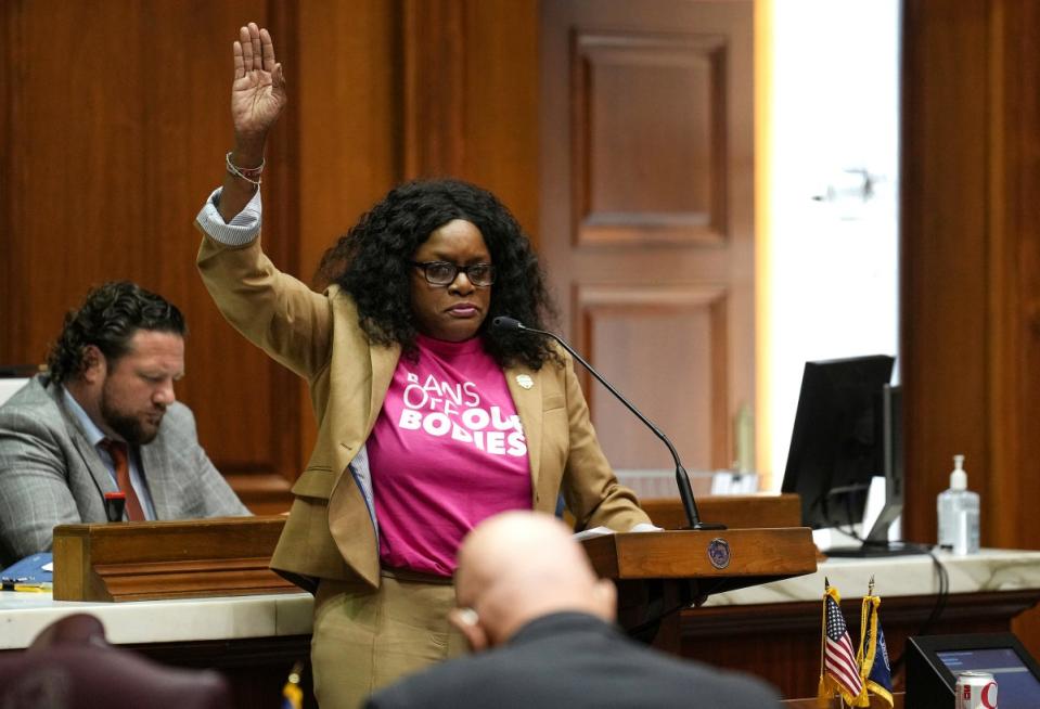 Indiana state Rep Renee Pack speaks out against an anti-abortion bill during debate on 5 August (AP)