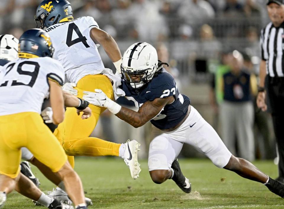 Penn State linebacker Curtis Jacobs stops West Virginia’s CJ Donaldson Jr during the game on Saturday, Sept. 2, 2023.