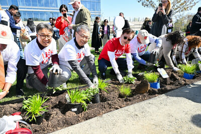 Chris Jung, center left, President and CEO of LG Electronics North America, and Mayor Mark Park, center right, of Englewood Cliffs, plant native species at the new pollinator garden at Life's Good Earth Day Community Fair, Monday, April 22, 2024, at the LG Electronics North American Innovation Campus in Englewood Cliffs, NJ.  The event hosted a range of activities that highlighted the importance of sustainable practices including the unveiling of the pollinator garden which earned a Certified Wildlife Habitat® certification from National Wildlife Federation. (Diane Bondareff/AP Images for LG Electronics)