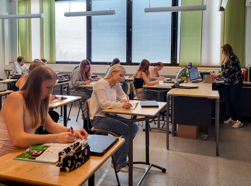 Pupils follow an English language lesson at Pohjolanrinne middle school in Riihimaki