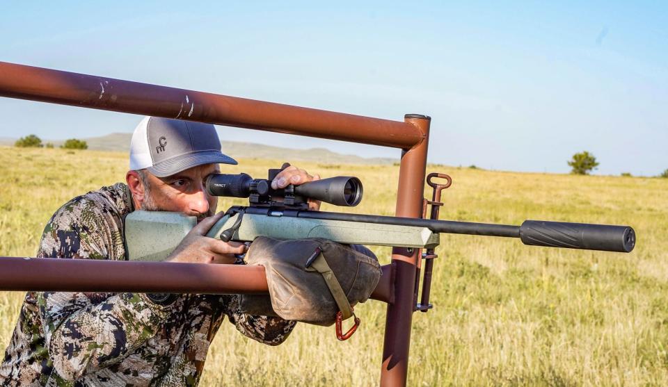 Springfield Armory Model 2020 Rimfire being shot off a gate