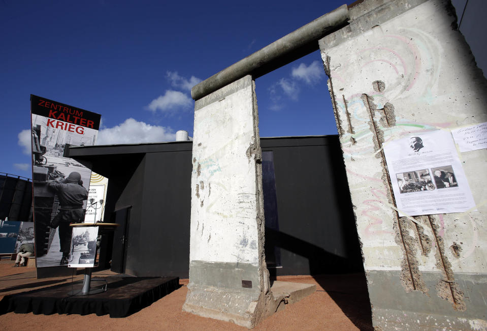 Two pieces of the Berlin Wall are placed in front of the new cold war museum 'Black Box' at the Checkpoint Charlie in Berlin, Germany, Thursday, Sept. 20, 2012. (AP Photo/Michael Sohn)