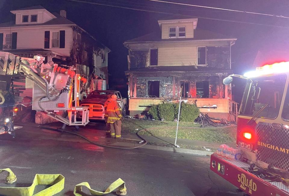 Crews from the Binghamton Fire Department battle a blaze that damaged two homes and killed one occupant late Friday, Dec. 8, 2023 on Colfax Avenue in the city.