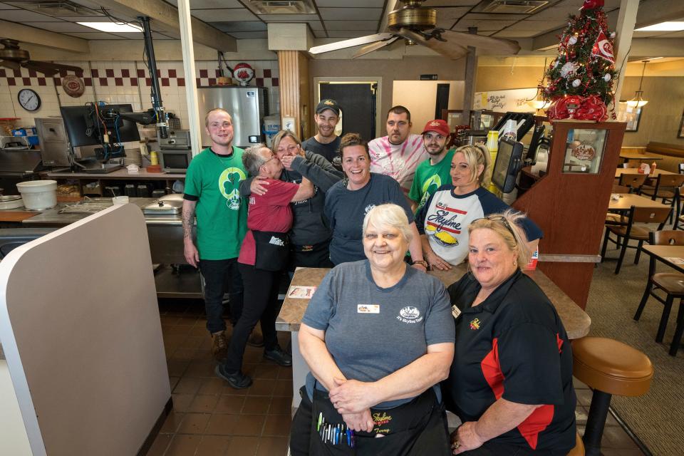A “3rd and Philly” staff gather for a group photo at the Skyline Chili location on West 3rd Street in Covington, Ky., Monday, April 24, 2023.