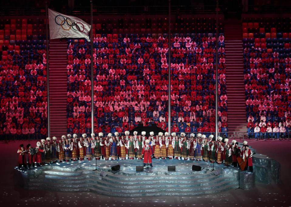 Performers sing on stage before the start of the closing ceremony of the 2014 Winter Olympics, Sunday, Feb. 23, 2014, in Sochi, Russia. (AP Photo/Ivan Sekretarev)