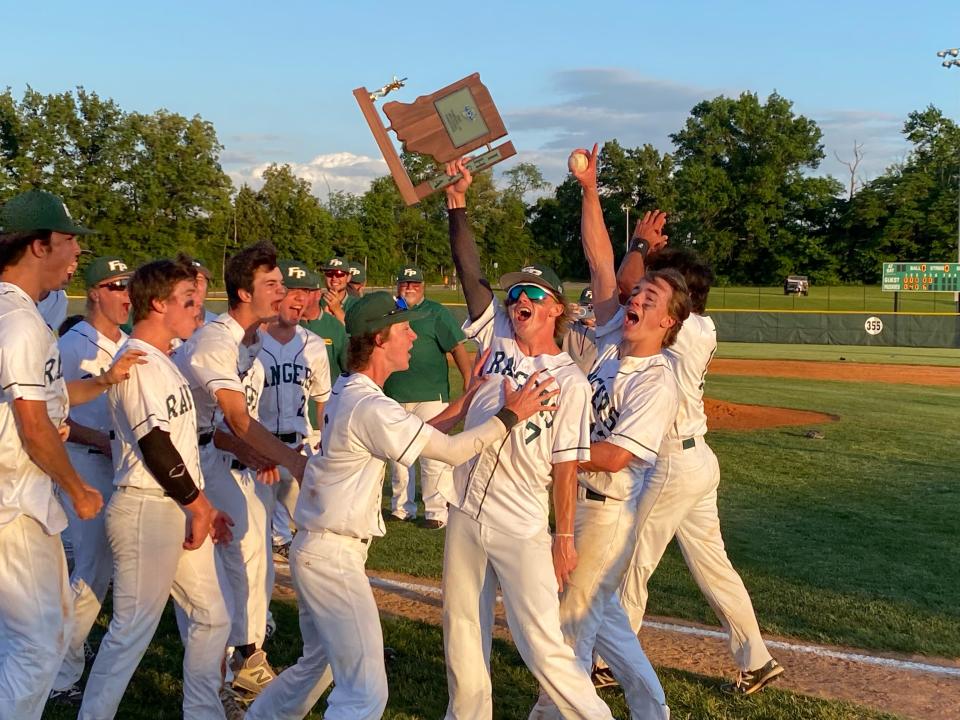 Forest Park senior Brody Klem holds up the Class 2A sectional baseball championship trophy after the Rangers defeated Tell City 10-0 in five innings at North.