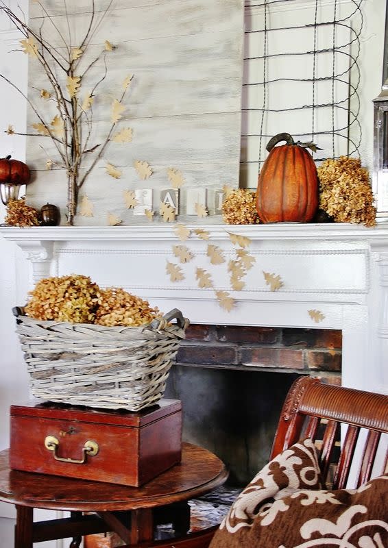 <p>A tree made of backyard sticks and raffia adds some height to this decidedly country mantel. Pumpkins, dried flowers, barnwood, and a letter display that spells "fall" round out the look.</p><p><strong>See more at <a href="http://www.thistlewoodfarms.com/a-fall-mantel/" rel="nofollow noopener" target="_blank" data-ylk="slk:Thistlewood Farms;elm:context_link;itc:0;sec:content-canvas" class="link ">Thistlewood Farms</a>.</strong> </p>