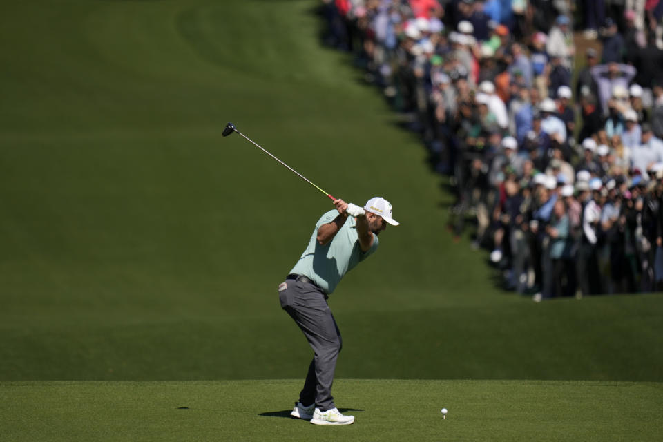 Jon Rahm, of Spain, hits his tee shot on the third hole during the final round at the Masters golf tournament on Sunday, April 10, 2022, in Augusta, Ga. (AP Photo/Jae C. Hong)