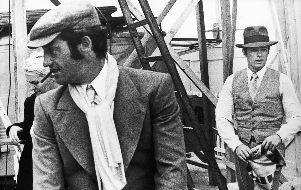 FILE - In this 1969 file photo, French actors Jean-Paul Belmondo. left, and Alain Delon are seen during the shooting of a Jacques Deray film, "Borsalino" in Marseille, France. French New Wave actor Jean-Paul Belmondo has died, according to his lawyer’s office on Monday Sept. 6, 2021. (AP Photo/File)