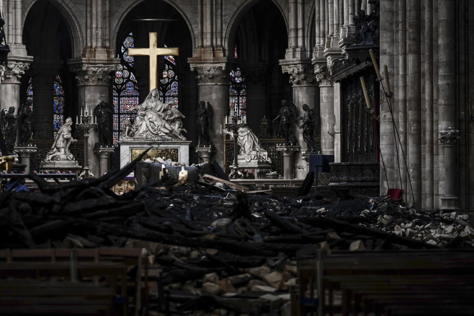 Rubble and the cross inside the Notre Dame de Paris Cathedral, May 15, 2019 in Paris. (Photo: Philippe Lopez/Pool via AP)          