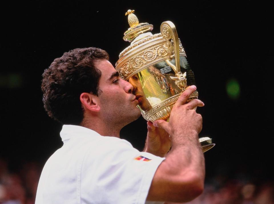 PHOTO: Pete Sampras is reflected in the Gentlemen's Singles Championship Trophy during their Men's Singles Final match at the Wimbledon Lawn Tennis Championship on 5th July 1998 at the All England Lawn Tennis and Croquet Club in Wimbledon, London. (Gary M. Prior/Getty Images, FILE)