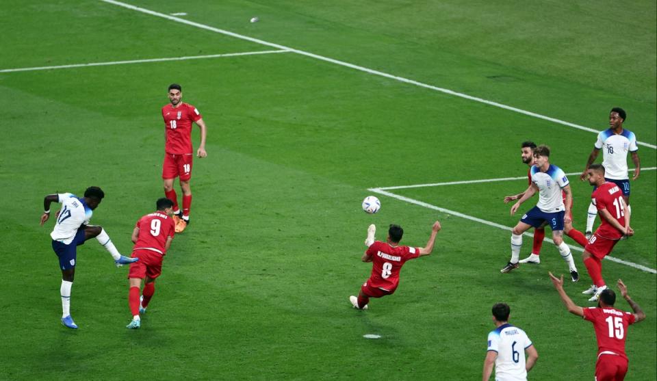 Bukayo Saka strikes the ball to score England’s second (Reuters)