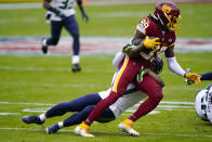 Washington Football Team wide receiver Cam Sims (89) is stopped by Seattle Seahawks free safety Quandre Diggs (37) during the first half of an NFL football game, Sunday, Dec. 20, 2020, in Landover, Md. (AP Photo/Susan Walsh)