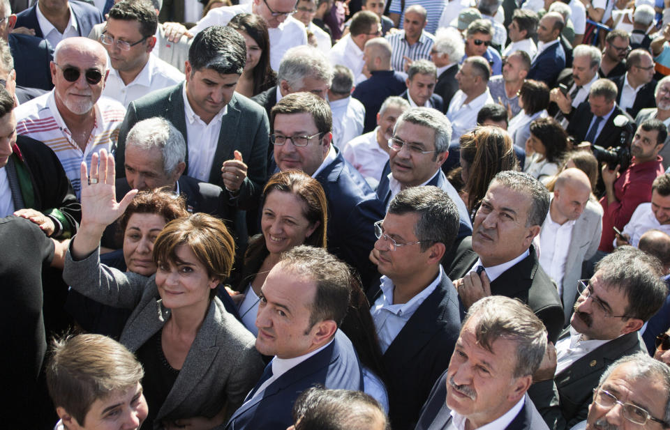 Canan Kaftancioglu, the head of Turkey's secular Republican People's Party in Istanbul, gestures after her trial in Istanbul, Friday, Sept. 6, 2019. Turkey's state-run news agency says a court has sentenced the leader of the Istanbul branch of Turkey's main opposition party to nearly 10 years in prison over a series of tweets.(AP Photo)