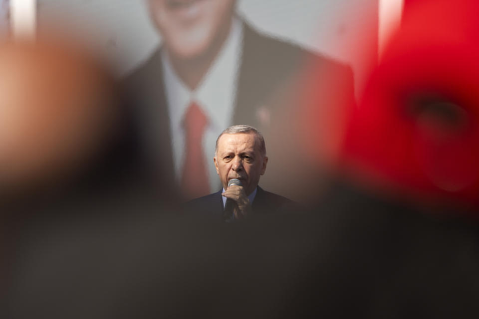 Turkish President and leader of the Justice and Development Party, or AKP, Recep Tayyip Erdogan, gives a speech during a campaign rally ahead of nationwide municipality elections, in Istanbul, Turkey, Sunday, March 24, 2024. With local elections across Turkey days away, legal experts are coaching thousands of volunteer election monitors on the rules they'll need to watch for fraud and ensure a fair vote. (AP Photo/Francisco Seco)